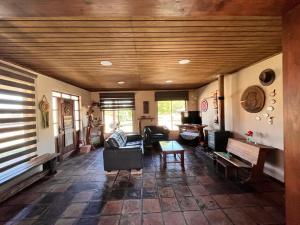 a living room with a couch and a table at Casa Campestre in Molina