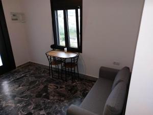 A seating area at Helios Stays - Sisi Private Apartments