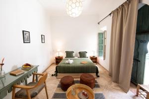 Postel nebo postele na pokoji v ubytování Riad Agathe & Spa