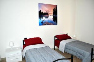 Posteľ alebo postele v izbe v ubytovaní Residence Le Groane