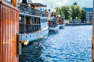 a group of boats docked in a body of water at Saimaa Experience in Savonlinna