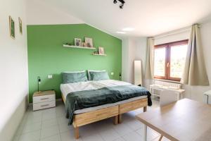 Postel nebo postele na pokoji v ubytování Maeva Guesthouse