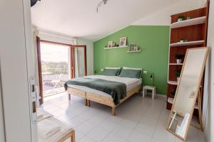 Postel nebo postele na pokoji v ubytování Maeva Guesthouse