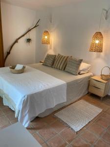 Voodi või voodid majutusasutuse Casa Xarém - Vinhas de Nexe toas