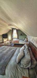 a bedroom with two beds in a tent at Tully View House in Donegal