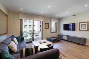 A television and/or entertainment centre at RAMBLA POBLENOU Luxury