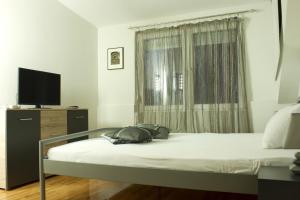מיטה או מיטות בחדר ב-Guest house Kozle