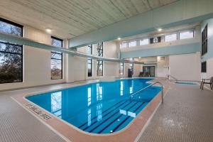 a large indoor swimming pool with blue water at Best Western Brantford Hotel and Conference Centre in Brantford