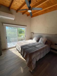 Ένα ή περισσότερα κρεβάτια σε δωμάτιο στο DelViento Cabañas +24 φωτογραφίες