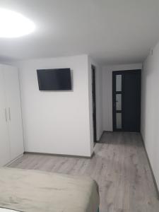 TV a/nebo společenská místnost v ubytování GREY VILLAS