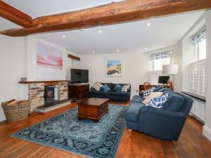 a living room with two couches and a fireplace at Park View in Bodmin