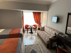 Letto o letti in una camera di Gawharet Al Ahram Hotel