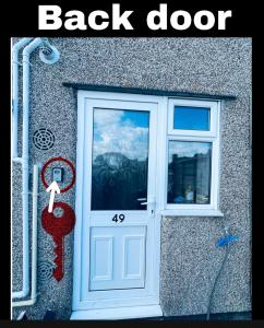 a door to a back door with a picture of a mountain at Single Room, Shared House in Bristol
