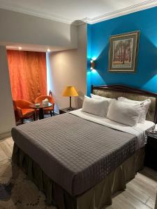 Letto o letti in una camera di Gawharet Al Ahram Hotel