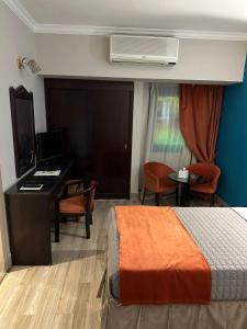 Letto o letti in una camera di Gawharet Al Ahram Hotel