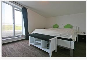 Postel nebo postele na pokoji v ubytování Dünenhotel Borkum