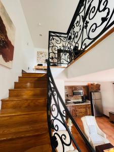 a spiral staircase in a home with a kitchen at The Cozy Villa in Los Angeles