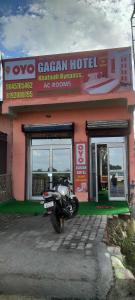 a motorcycle parked in front of a building at SPOT ON Gagan Hotel in Khatauli