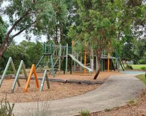 a playground with a slide in a park at Guest house on the park in Burwood East