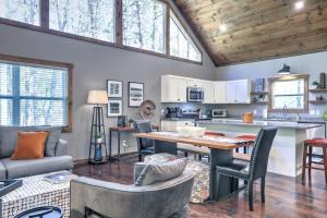 a kitchen and living room with a wooden ceiling at Napa Blue Ridge Cabin in Blue Ridge