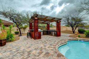 a gazebo next to a swimming pool at Arizona Vacation Rental with Private Pool and Pergola! in Phoenix
