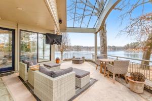 an open living room with a view of the water at Ledgerwood Point in Hot Springs