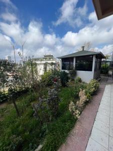 a garden with flowers and a building in the background at NEAR SUITES in Istanbul