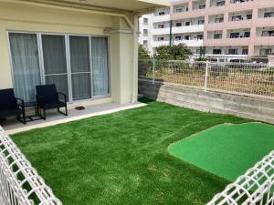 Zahrada ubytování New Normal Hotel in NAGO ニューノーマルホテルイン名護