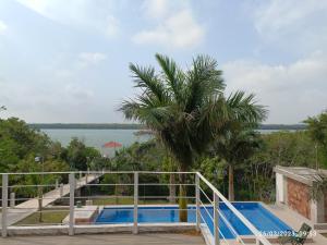 a swimming pool with a view of the water at Quinta La Calma in La Pesca