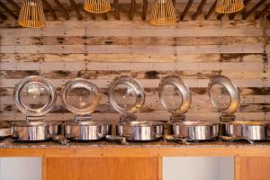 a bunch of pots and pans on a counter at El Nido Bayview Resort in El Nido