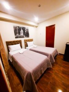 Postel nebo postele na pokoji v ubytování Brianny Hotel