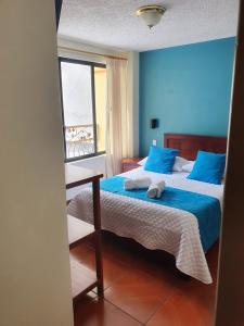 Voodi või voodid majutusasutuse Hostal CañaLimeña toas