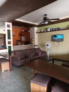 a living room with a couch and a table at Mactan Pension House in Mactan