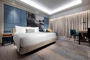 Voodi või voodid majutusasutuse Lisboeta Macau toas