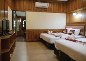 Ένα ή περισσότερα κρεβάτια σε δωμάτιο στο Sisatchanalai Heritage Resort +58 φωτογραφίες