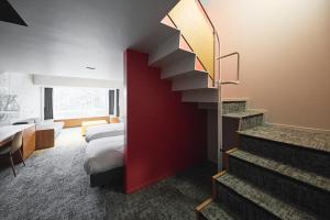 Fourtreat Kusatsu客房内的一张或多张床位