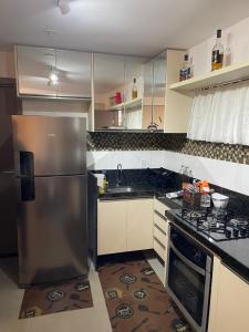 Η κουζίνα ή μικρή κουζίνα στο FLAT MAUI TAMANDARÉ