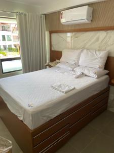 Ένα ή περισσότερα κρεβάτια σε δωμάτιο στο FLAT MAUI TAMANDARÉ +22 φωτογραφίες