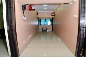 a hallway in a building with a hallway at Goroomgo Dev Guest House Howrah, Kolkata in Hāora