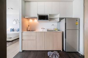 Kuchyň nebo kuchyňský kout v ubytování Veranda Residence/2BRFamilySuite