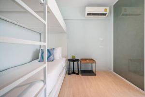 Postel nebo postele na pokoji v ubytování Veranda Residence/2BRFamilySuite
