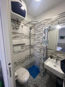 a bathroom with a toilet and a sink at Truly Apulia in Bari