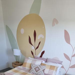 a bedroom with a bed with a large mural on the wall at Spectacular Waterfront Views Discover the Hidden Gem of Cronulla with our Rare 3 Bedroom Apartment with Free Parking in Cronulla