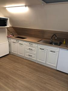 A kitchen or kitchenette at Apartmány u vleku - Podkrovní apartmán