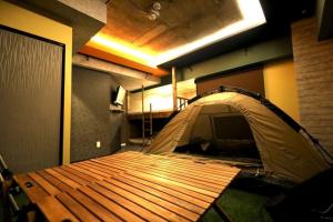 A bed or beds in a room at MolinHotels506 アクティビティを満喫できる札幌定山渓 天然温泉付- CampRoom S-Beds6
