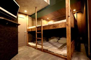 A bed or beds in a room at MolinHotels506 アクティビティを満喫できる札幌定山渓 天然温泉付- CampRoom S-Beds6