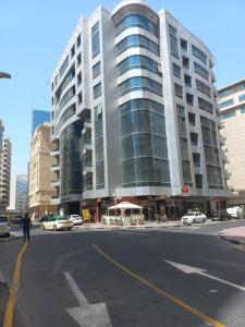 a large building on the corner of a city street at Budget Place in Dubai