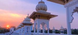 a white building with a dome on top of it at Hotel Gautam Lonavala in Lonavala