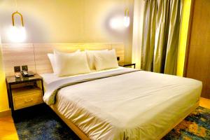 Series Hotel Sudirmanにあるベッド