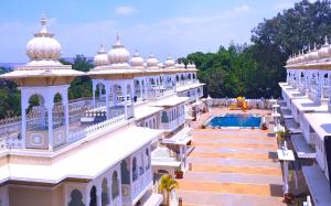 an aerial view of a building with a pool at Hotel Gautam Lonavala in Lonavala